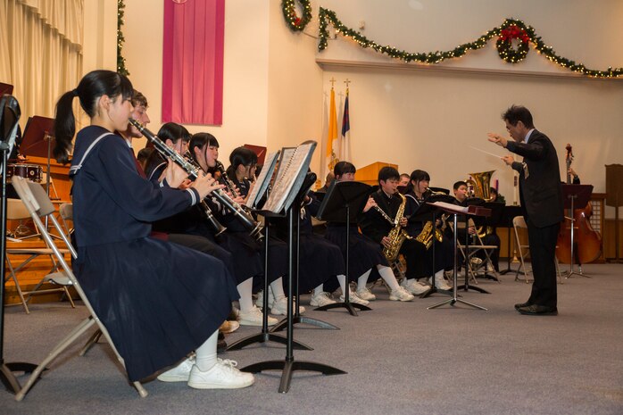 Students from Higashi Junior High School perform during the holiday concert, Dec. 15, 2014, held at the Marine Memorial Chapel aboard Marine Corps Air Station Iwakuni, Japan. The concert was held for students from Higashi Junior High School, Agenosho Elementary School and Matthew C. Perry Schools.