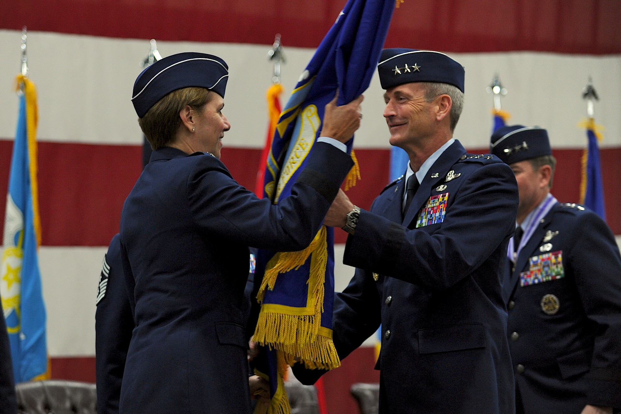 Lt. Gen. Terrence J. O'Shaughnessy accepts the Seventh Air Force guidon from Gen. Lori Robinson, Pacific Air Forces commander, during a change of command ceremony at Osan Air Base Dec 19, 2014. Lt. Gen. O'Shaughnessy became the 33rd commander of Seventh Air Force, taking over for Lt. Gen. Jan-Marc Jouas who served in the position for nearly three years. (U.S. Air Force photo by Maj. John Ross)