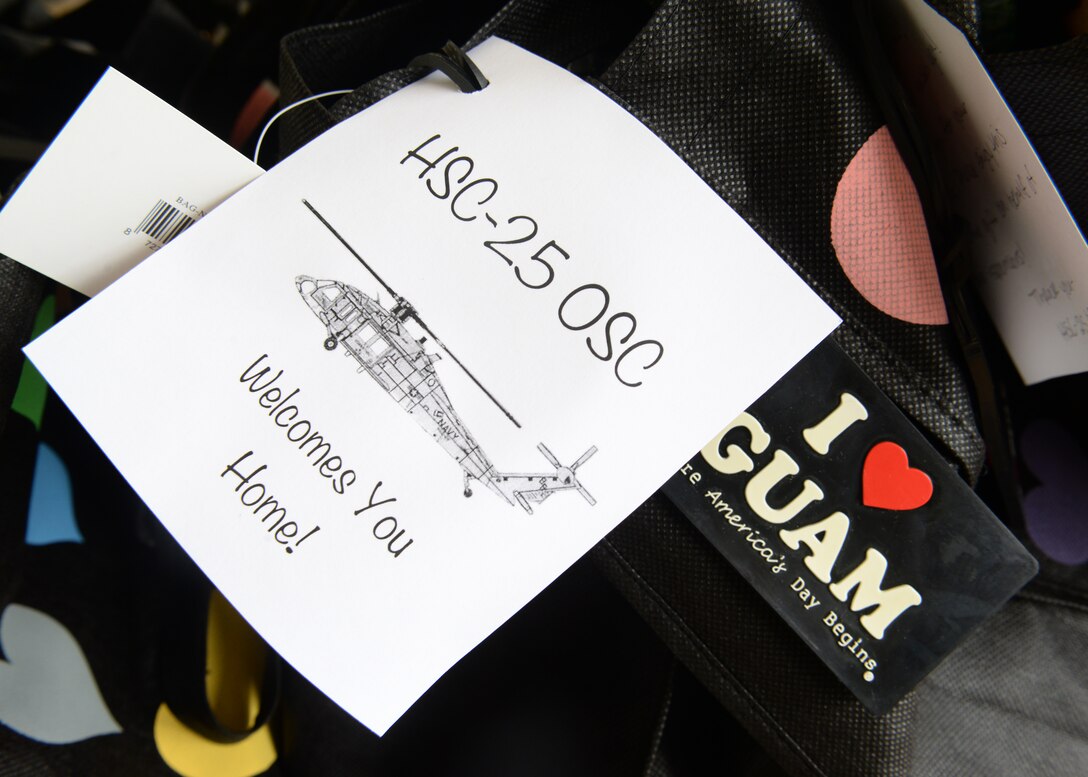 The U.S. Navy’s Helicopter Sea Combat Squadron 
25 welcomes Sailors home after a seven month 
deployment Dec. 11, 2014, at Andersen Air Force 
Base, Guam. The Sailors supported a Combat 
Logistic Force mission from the USNS Washington 
Chambers in support of Commander Task Force 73
 including the George Washington Carrier Strike 
Group, Peleliu Expeditionary Strike Group and 
numerous Republic of Korea and Japanese 
Maritime Self-Defense Force vessels.  (U.S. Air 
Force photo by Airman 1st Class Amanda 
Morris/Released)
