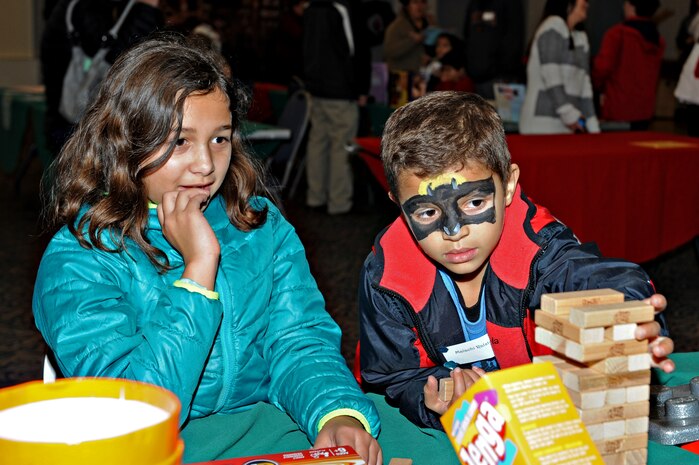 Children participate in activities during the Exceptional Family Member Program holiday party Dec. 17, 2014, at Beale Air Force Base, Calif. The EFMP is designed to provide support to family members, both adult and children with special needs such as a physical, developmental, or mental disorder requiring specialized services. (U.S Air Force photo by Airman 1st Class Ramon A. Adelan/Released)