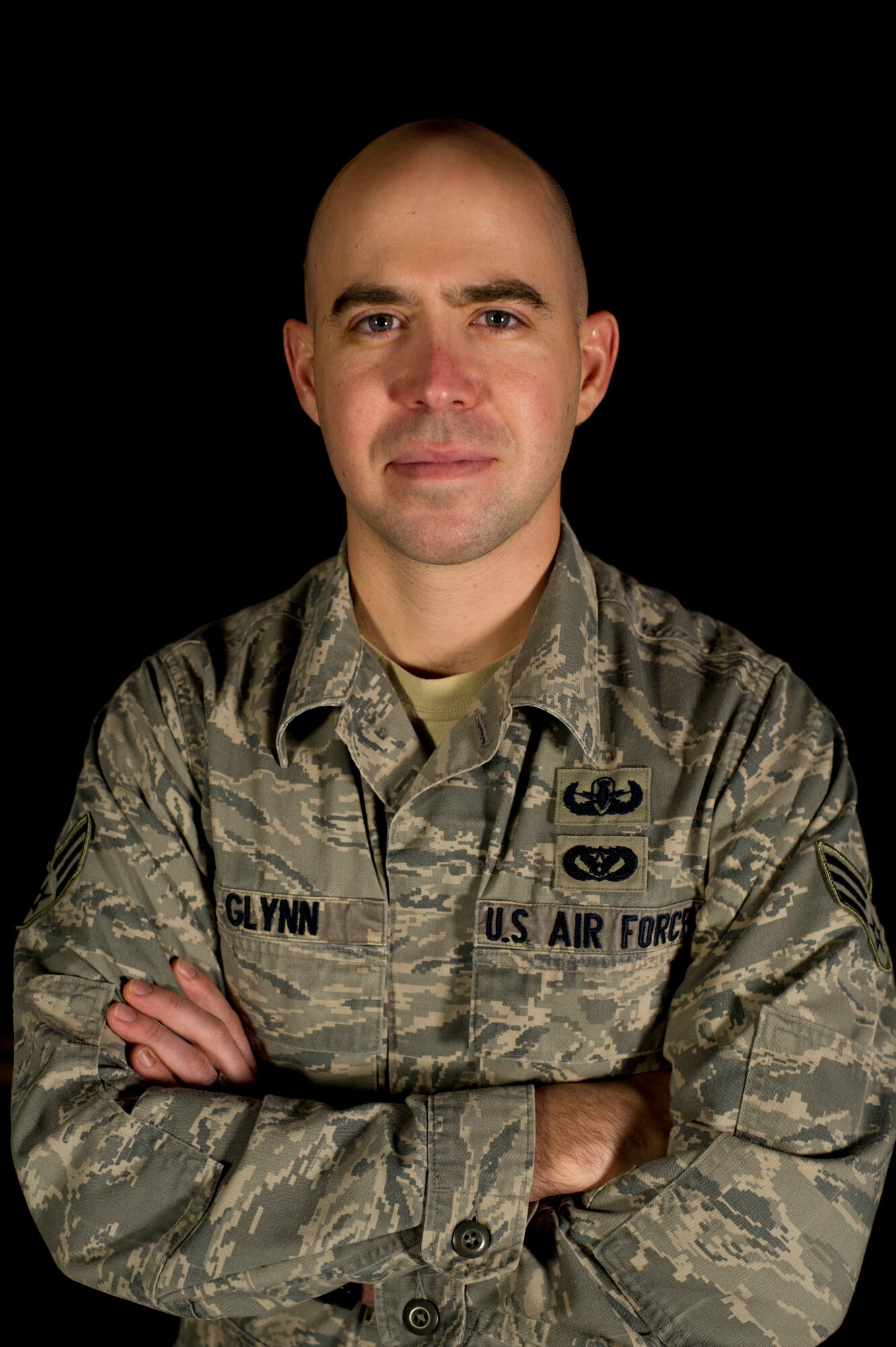 Senior Airman Andrew Glynn, 5th Civil Engineering Squadron explosive ordnance disposal specialist, poses for a photo on Minot Air Force Base, N.D., Dec. 18, 2014. Glynn was among the last of the Air Force EOD to pull out of Afghanistan, but not before making sure that the EOD mission was in good hands. He worked directly with the Afghani National Police EOD in Kandahar, helping them not only with EOD expertise, but with building the infrastructure necessary for the local forces to get the materials they need to complete the mission, like equipment and explosives. (U.S. Air Force photo/Senior Airman Brittany Y. Bateman)