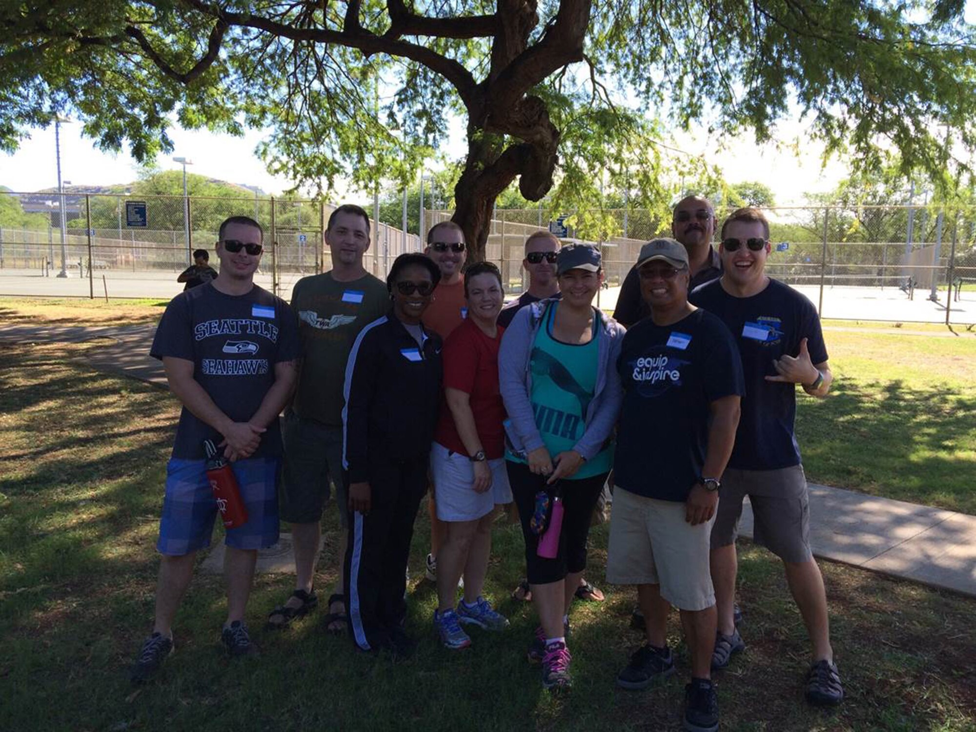 TRAVIS AIR FORCE BASE, Calif. --  Lt. Col. Polly Raffetto and Master Sgt. Steve Mitchell, 349th Air Mobility Operations Squadron, took some of their personal time during a mission to volunteer, alongside members of the 613th Air and Space Operations Center, Joint Base Pearl Harbor-Hickam, Dec. 6. (U.S. Air Force photo / Maj. Jeffrey Webb)
