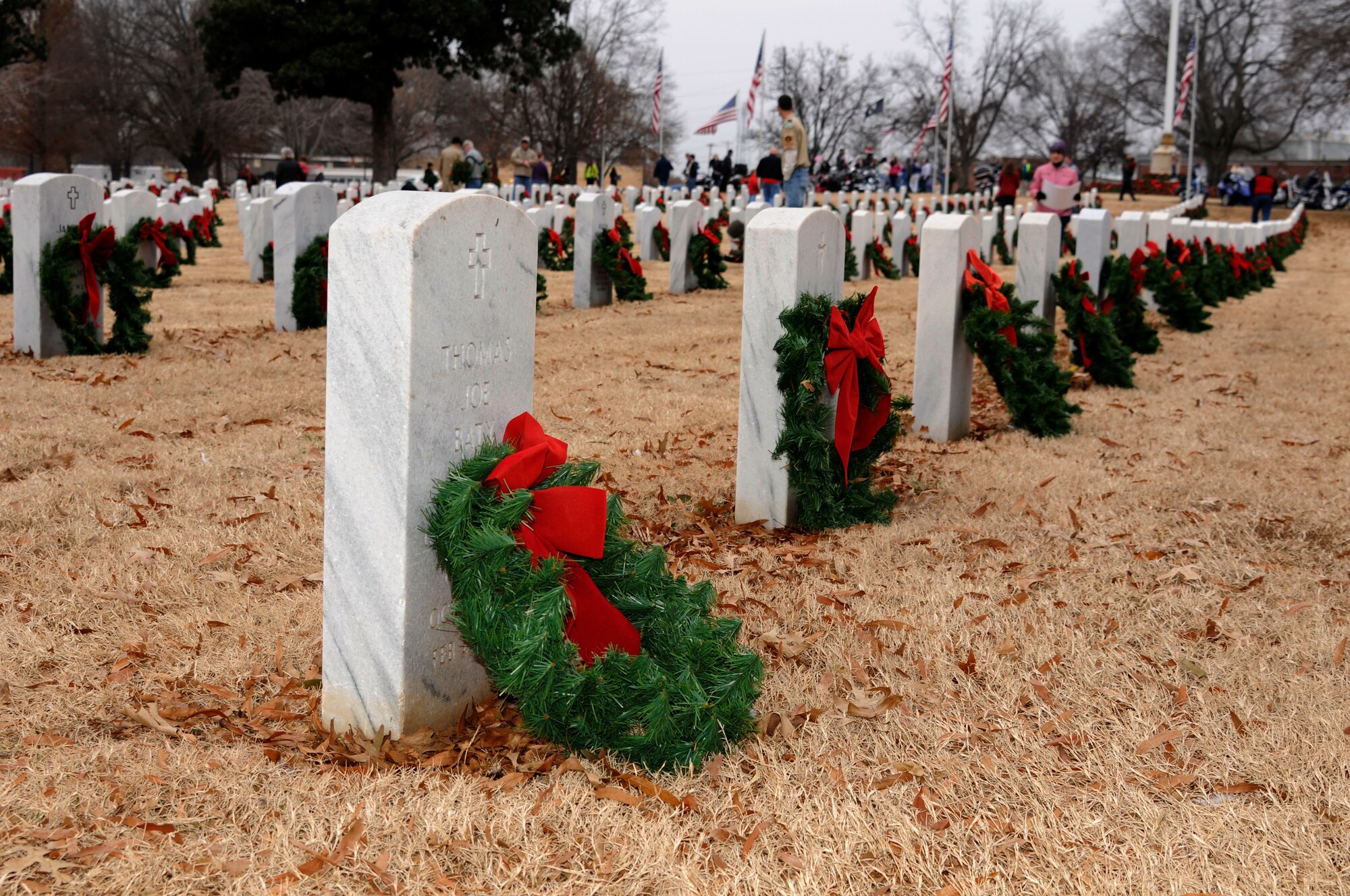 Airmen from the 188th Wing Honor Guard posted the colors during the annual Christmas Honors wreath ceremony at the U.S. National Cemetery in Fort Smith, Ark., Dec. 13, 2014. In 2009, the Fort Smith Regional Chamber of Commerce held the first Christmas Honors inspired by the Wreaths Across America program. Wreaths Across America was founded by Morrill Worcester to remember the fallen, honor those who served and teach children the value of freedom. (U.S. Air National Guard photo by Staff Sgt. Hannah Dickerson/released)