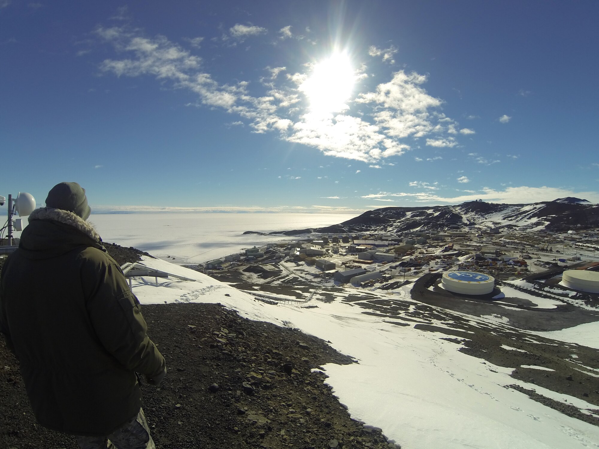 Chief Master Sgt. James W. Hotaling, the command chief master sergeant of the Air National Guard, looks out over the facilities at McMurdo Station, Antarctica. Hotaling visited ANG Airmen working there in support of the US Antarctic Program and the National Science Foundation in order to learn about the mission they perform, and understand the unique challenges they face in their jobs. (courtesy photo)