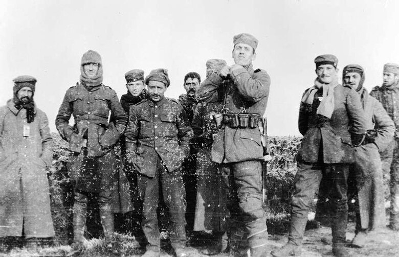 German soldiers of the 134th Saxon Regiment photographed with men of the Royal Warwickshire Regiment in No Man’s Land on the Western Front, Christmas Day, 1914. (Royal Field Artillery Regiment photo/Lt. C. A. Drummond)