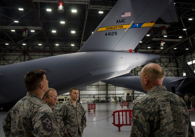 Col. Jeffrey DeVore, Joint Base Charleston commander, and Chief Master Sgt. Mark Bronson, 628th Air Base Wing command chief, meets with members  of the chapel staff, Dec. 17, 2014, at JB Charleston, S.C.. The meeting was part of an initiative to show JB Charleston leadership a closer look at various missions throughout JB Charleston. (U.S. Air Force photo / Senior Airman Tom Brading)