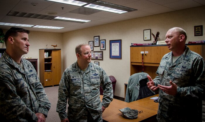 Chaplain (Capt.) Ryan Ayers meets with Col. Jeffrey DeVore, Joint Base Charleston commander, and Chief Master Sgt. Mark Bronson, 628th Air Base Wing command chief Dec. 17, 2014, at JB Charleston, S.C.. The meeting was part of an initiative to show JB Charleston leadership a closer look at various missions throughout JB Charleston. (U.S. Air Force photo / Senior Airman Tom Brading)