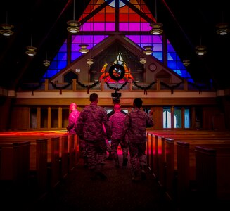 Col. Jeffrey DeVore, Joint Base Charleston commander, and Chief Master Sgt. Mark Bronson, 628th Air Base Wing command chief, are led through the Chapel at JB Charleston - Air Base, S.C. The tour was part of an initiative to show JB Charleston leadership a closer look at various missions throughout JB Charleston. (U.S. Air Force photo / Senior Airman Tom Brading)