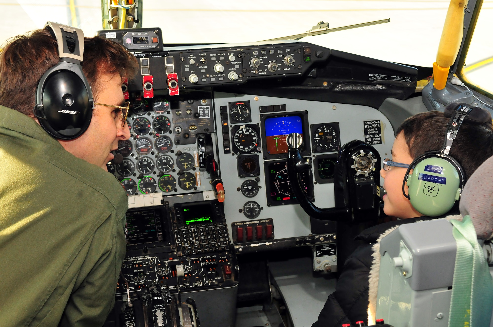 U.S. Air Force Major Joe Uehlin gets help preflighting a KC-135 from Roman Pettograsso, the 121st ARW honorary pilot for a day Dec 11, 2014 at Rickenbacker Air National Guard Base. (U.S. Air National Guard photo by Airman 1st Class Wendy Kuhn)