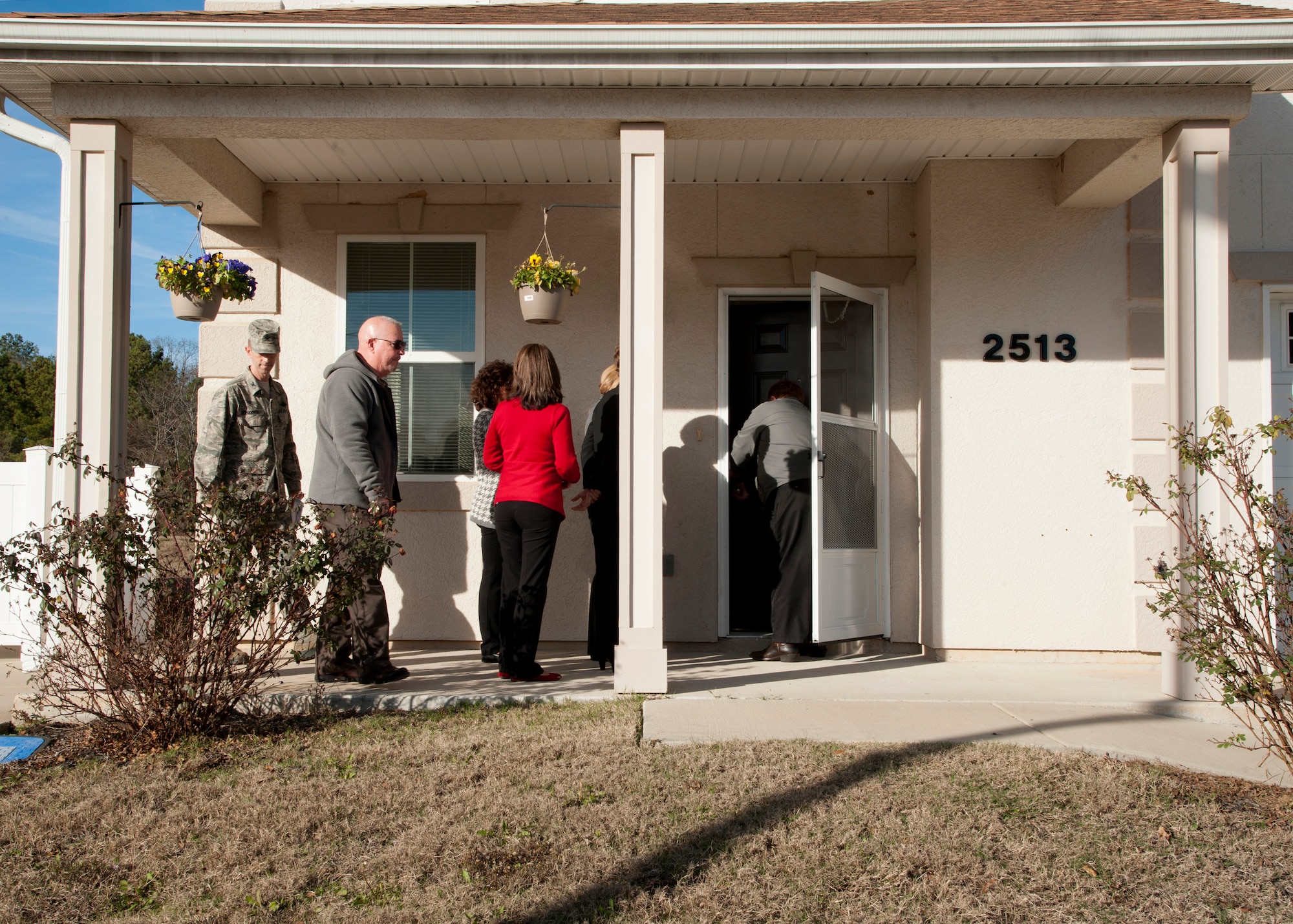 Base leadership spouses tour a home located in the Eastside Family Housing community during a tour of Barksdale Air Force Base, La., Dec. 16, 2014. The spouses toured the model home to have a better understanding of on-base housing. (U.S. Air Force photo/Senior Airman Joseph A. Pagán Jr.)