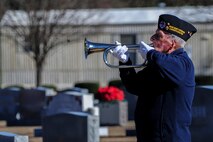 Retired Navy Master Chief Petty Officer Doc Phelps plays “Taps” during National Wreaths Across America Day at Evergreen Memorial Cemetery in Princeton, North Carolina, Dec. 13, 2014. During this second iteration of the event at Evergreen, approximately $4,500 was raised to fund the 450 wreaths that were laid during the ceremony. (U.S. Air Force photo by Airman 1st Class Brittain Crolley)