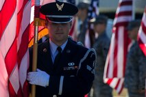 Senior Airman Kyle Decker, 4th Fighter Wing honor guardsman, retires the colors during National Wreaths Across America Day at Evergreen Memorial Cemetery in Princeton, North Carolina, Dec. 13, 2014. The event was part of the Wreaths Across America mission, which delivered hundreds of thousands of remembrance wreaths to more than 900 cemeteries across the country in honor of our nation’s fallen heroes. (U.S. Air Force photo by Airman 1st Class Brittain Crolley)