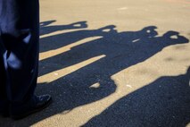 Junior ROTC cadets salute as the Seymour Johnson Air Force Base Honor Guard posts the colors during National Wreaths Across America Day at Evergreen Memorial Cemetery in Princeton, North Carolina, Dec. 13, 2014. During this second iteration of the event at Evergreen, approximately $4,500 was raised to fund the 450 wreaths that were laid during the ceremony. (U.S. Air Force photo by Airman 1st Class Brittain Crolley)