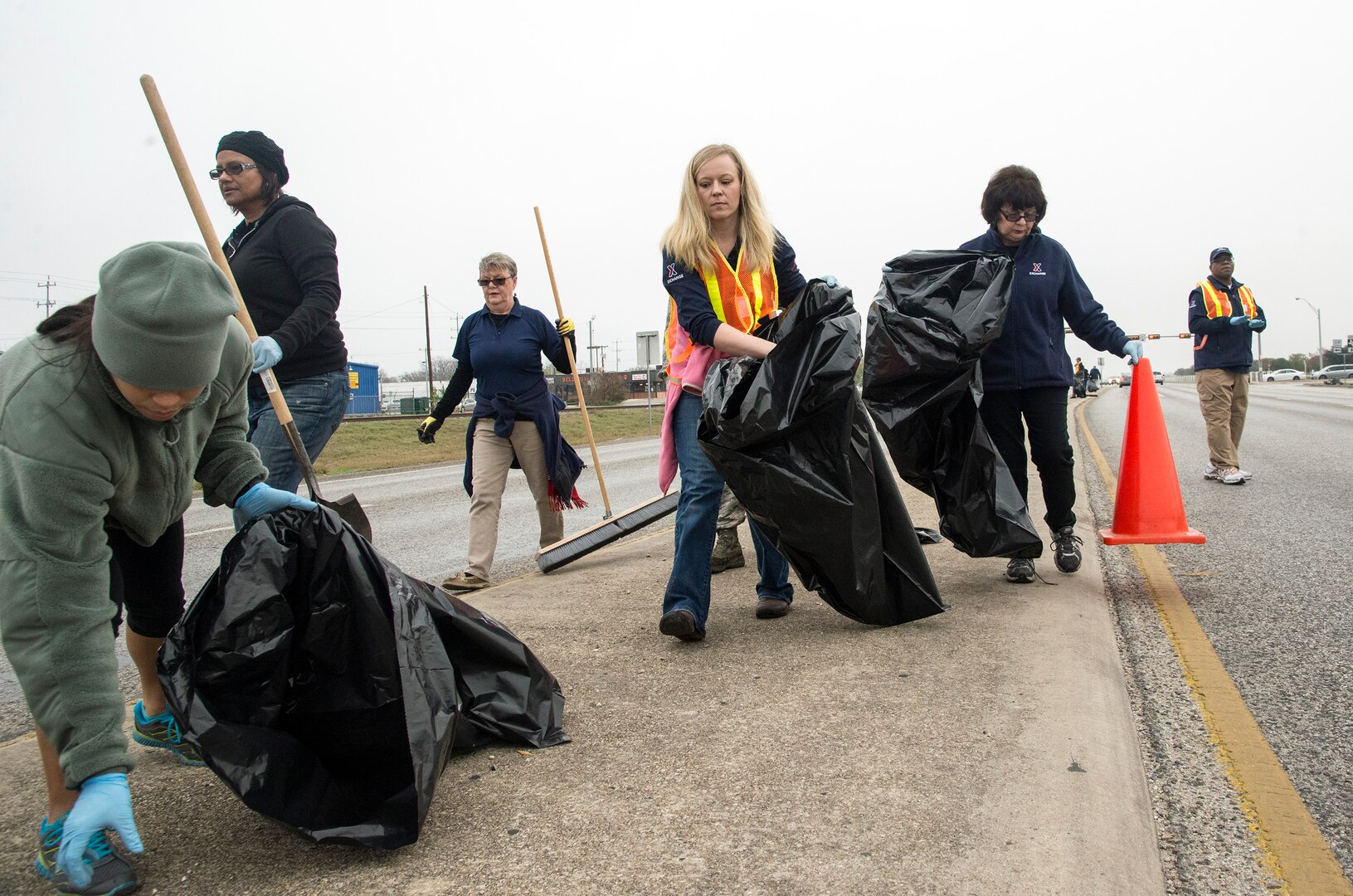 Airmen and staff members from the exchange pick up trash along the exterior perimeter of Joint Base San Antonio-Randolph Dec. 11. Airmen and civilians from across JBSA-Randolph cleaned location’s FM 78 along JBSA-Randolph’s perimeter in support of Operation Clean Sweep. (U.S. Air Force photo by Johnny Saldivar)