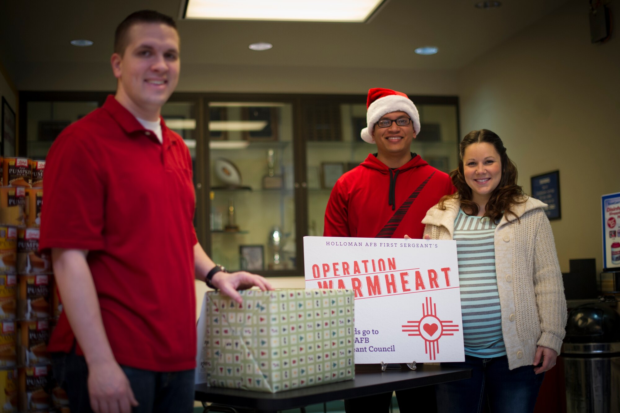 Members of Holloman’s First Sergeant Council collect donations in the base Commissary at Holloman Air Force Base, N.M., Dec. 17. Annually, the First Sergeants of Holloman join together to assist Airmen in need of financial help with their Operation Warm Heart campaign. All of the money is provided by Holloman’s own Airmen and other members of Team Holloman. They money they raise goes directly back to the Airmen in need through assistance with purchasing food and even donations to local organizations. (U.S. Air Force photo by Airman 1st Class Aaron Montoya / Released)