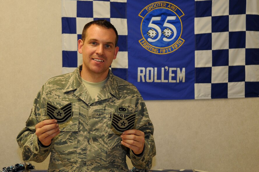 U.S. Air Force Tech. Sgt. Stephen Leonardi, 20th Aircraft Maintenance Squadron dedicated crew chief, holds up his new technical sergeant stripes after being recognized under the Air Force's Stripes for Exceptional Performers during a ceremony at Shaw Air Force Base, S.C., Dec. 18, 2014. Leonardi has been in the Air Force for nine years and is currently serving as the DCC for Maj. Gen. H.D. Polumbo Jr., Ninth Air Force commander. (U.S. Air Force photo by Airman 1st Class Michael Cossaboom/Released)