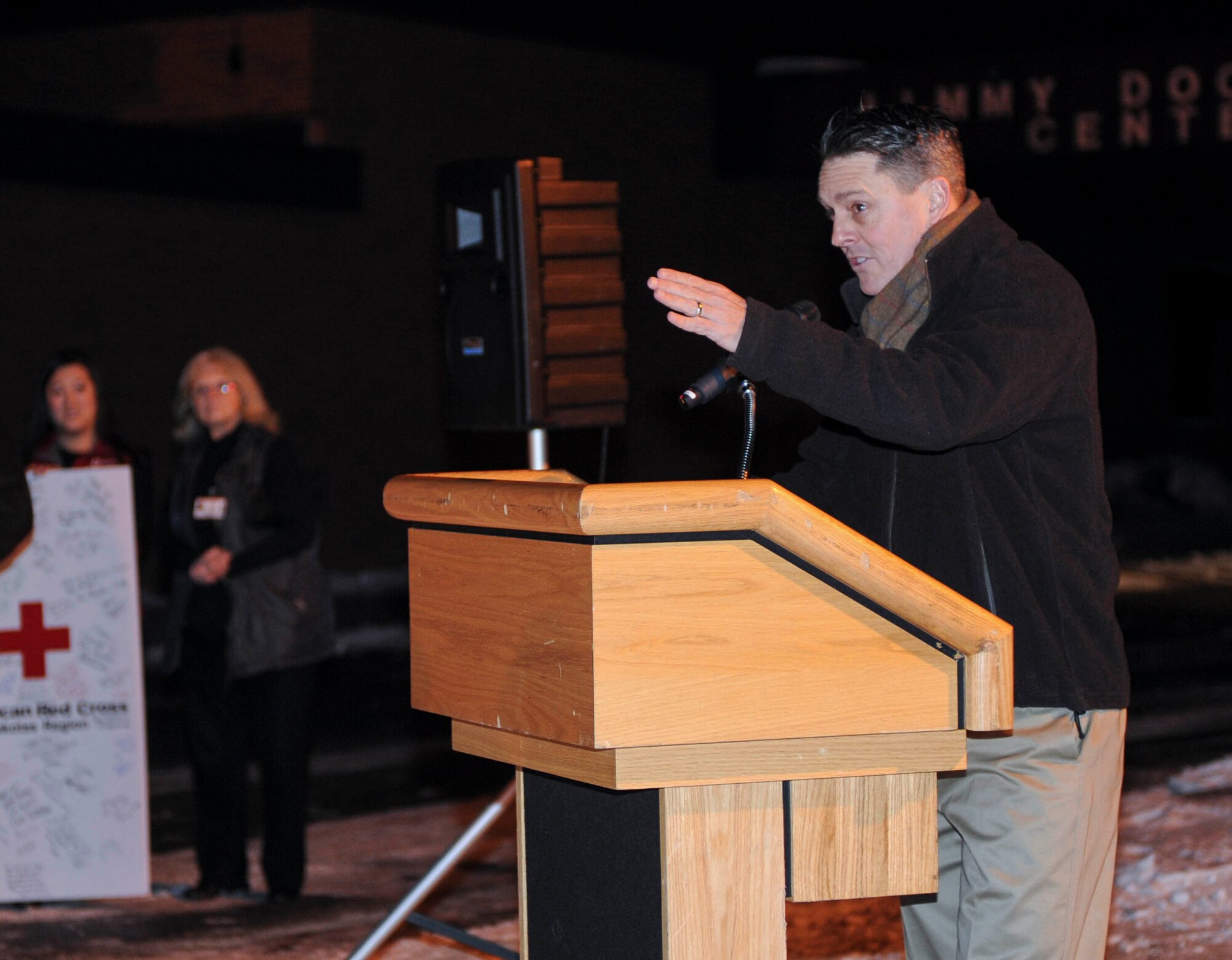 Col. Jason Armagost, 5th Bomb Wing commander, speaks during the holiday tree lighting event hosted at the Jimmy Doolittle Center on Minot Air Force Base, N.D. Dec. 6, 2014. Armagost called forward children attending the event to help him countdown to when the lights would be turned on. (U.S. Air Force photo/Senior Airman Stephanie Morris)