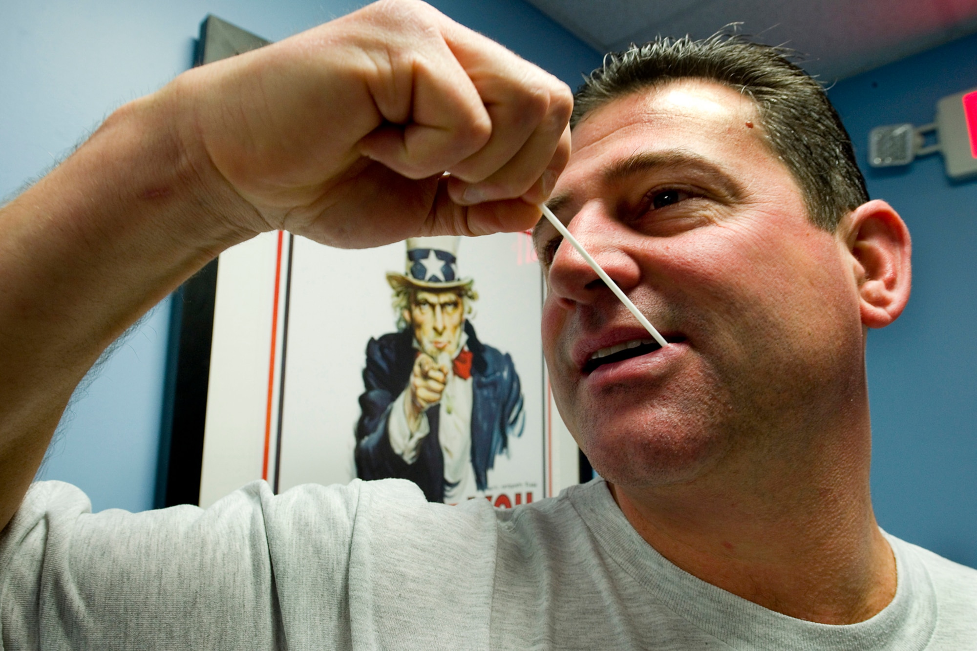 Senior Master Sgt. Aaron Wilson, 434th Aircraft Maintenance Squadron fabrication flight chief, swabs his cheek to enter a bone marrow donor registry during a visit to the clinic here Dec. 6. 2014. Nearly 200 Airmen registered for the program that may help save a life. (U.S. Air Force photo/Tech. Sgt. Douglas Hays)