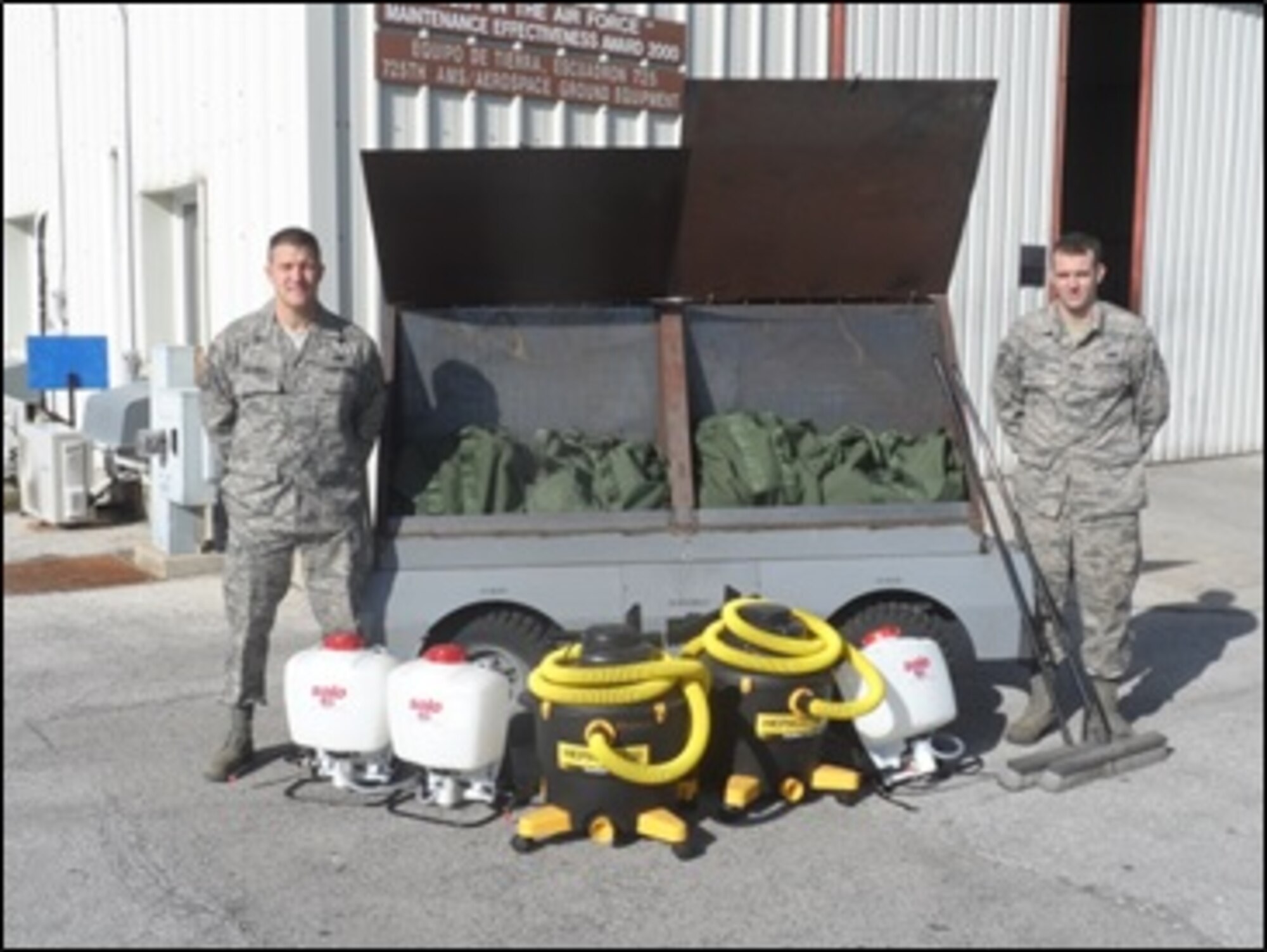 Master Sgt. Gregory Mitchell and Staff Sgt. Gregory Lyon of the 725 AMS stand beside the fully equipped trailer. (Courtesy Photo/Master Sgt. Jason Willis)