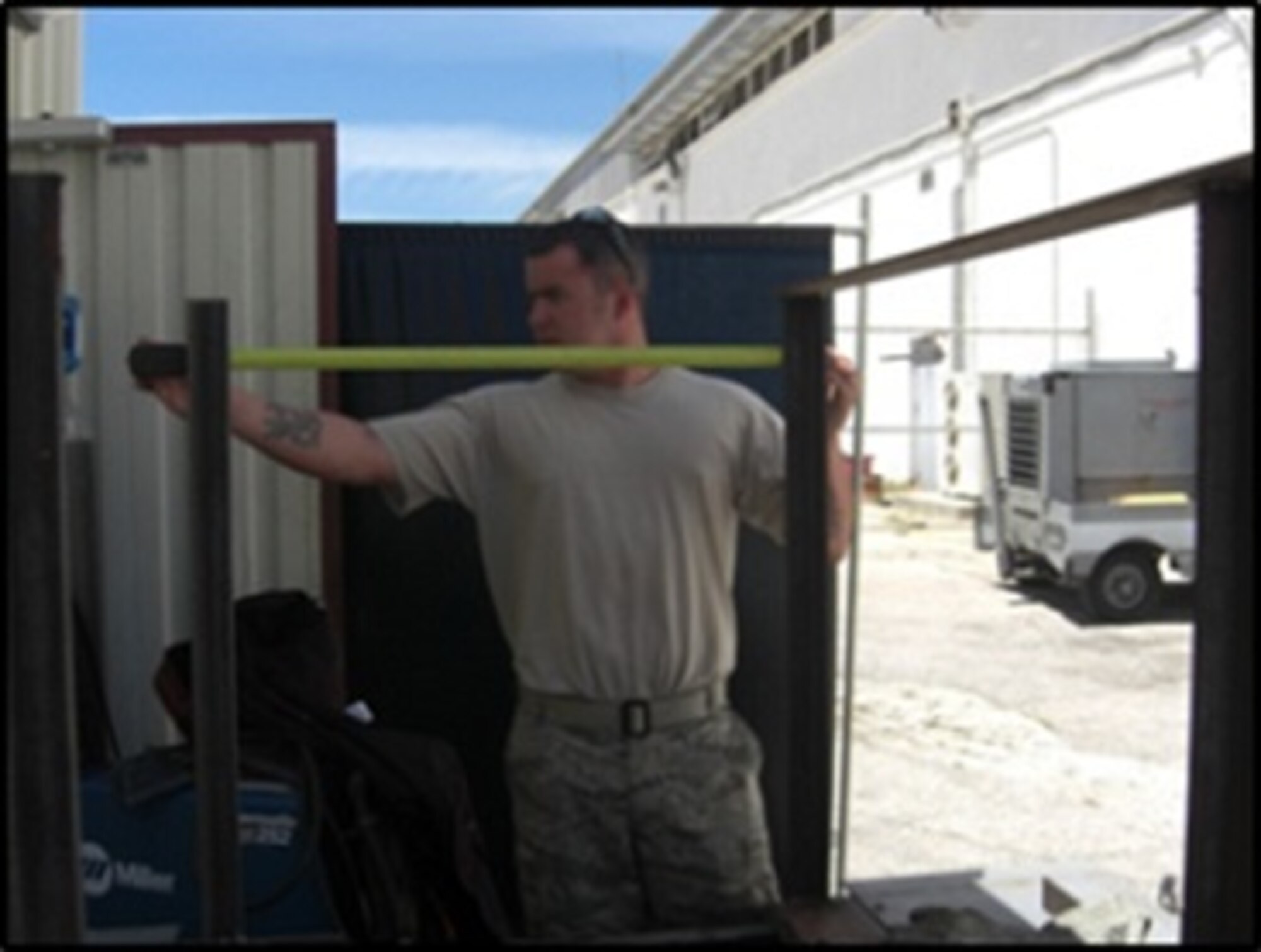Staff Sgt. Kristopher Snedecor taking measurements of the frame. (Courtesy Photo/Master Sgt. Jason Willis)