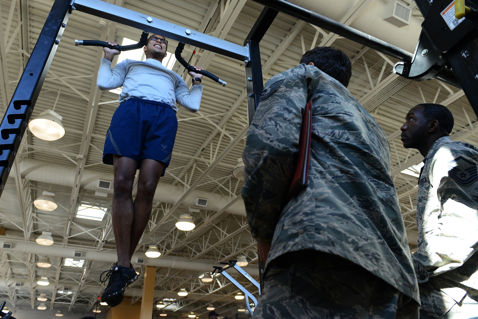 A U.S. Air Force Airman performs pull-ups during a physical ability and stamina test designed to test potential special tactics Airmen at Shaw Air Force Base, S.C., Dec. 10, 2014. Special tactics Airmen make up less than one percent of the Air Force. (U.S. Air Force photo by Airman 1st Class Diana M. Cossaboom/Released)