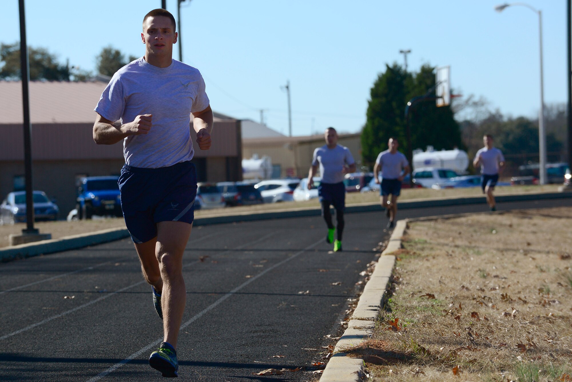 U.S. Air Force Airmen run around the track during a physical ability and stamina test at Shaw Air Force Base, S.C., Dec. 10, 2014. The Airmen had to complete a 1.5 mile run in the time specified by the special tactics career field they wish to enter. (U.S. Air Force photo by Airman 1st Class Diana M. Cossaboom/Released)