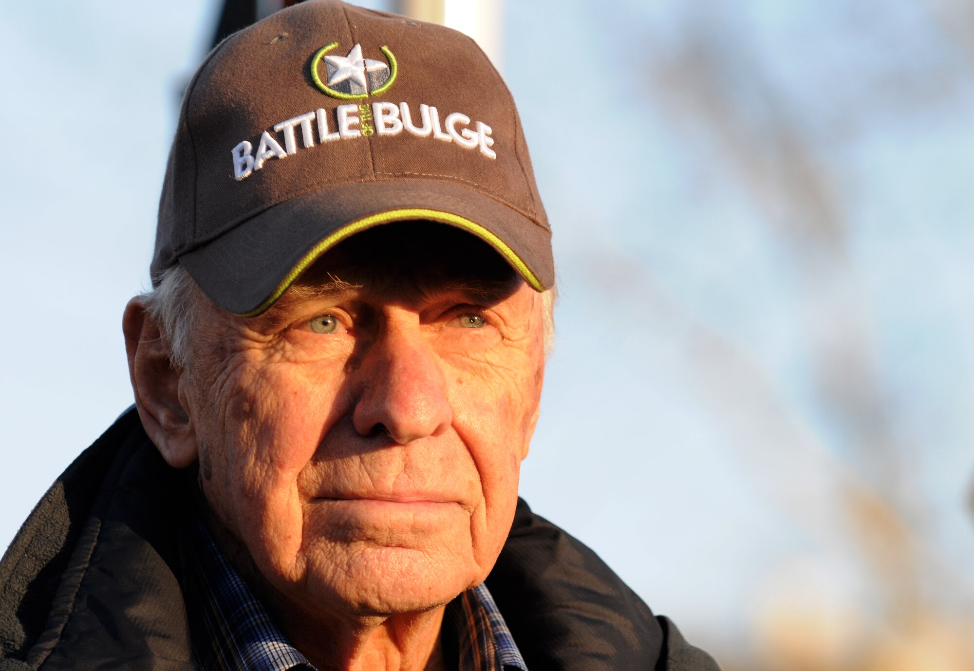 Fred Gordon, a retired U.S. Army lieutenant colonel and Battle of the Bulge veteran, listens to the U.S. national anthem during a Battle of the Bulge memorial ceremony at Vielsalm, Belgium, Dec. 14, 2014. Gordon was awarded a Presidential Unit Citation and Bronze Star Medal for his efforts in the war. (U.S. Air Force photo by Airman 1st Class Luke Kitterman/Released)