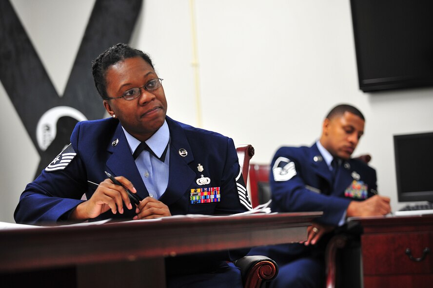 U.S. Air Force Master Sgt. Shavahn Erby, 35th Aerospace Medicine Squadron optometry flight chief, listens to an Airman undergoing a mock senior airman below-the-zone promotion board at Misawa Air Base, Japan, Dec. 15, 2014. Erby assisted as a judge during the board and provided feedback to those competing as a way to help them prepare for their upcoming official BTZ board. (U.S. Air Force photo by Senior Airman Jose L. Hernandez-Domitilo)