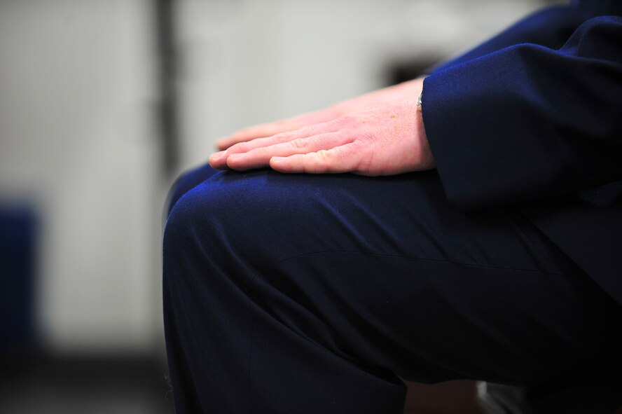 A U.S. Air Force airman first class sits at attention during a mock senior airman below-the-zone promotion board at Misawa Air Base, Japan, Dec. 15, 2014. As part the Professional Development Center’s new BTZ 101 course, Airmen participated in a mock board which evaluated them on Air Force knowledge, character and military bearing among, other areas. (U.S. Air Force photo by Senior Airman Jose L. Hernandez-Domitilo)