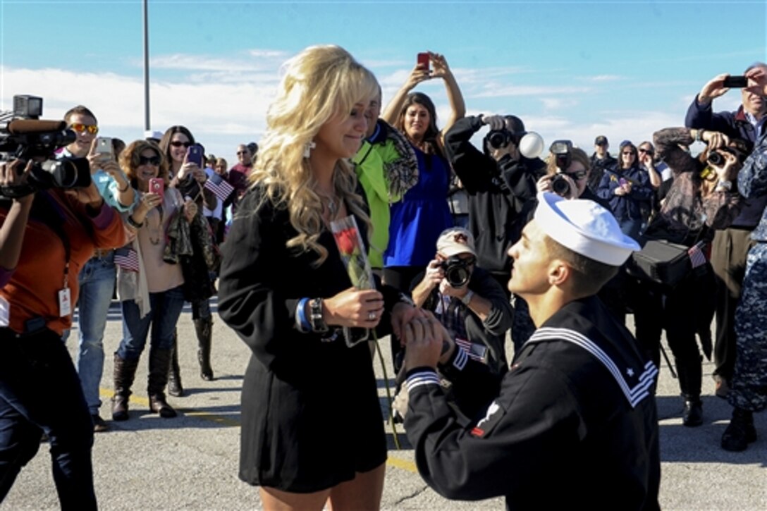 Navy Petty Officer 3rd Class Caleb Strother proposes to Brittney Apperson during a homecoming ceremony for the guided-missile frigate USS Samuel B. Roberts in Mayport, Fla., Dec. 15, 2014.  
