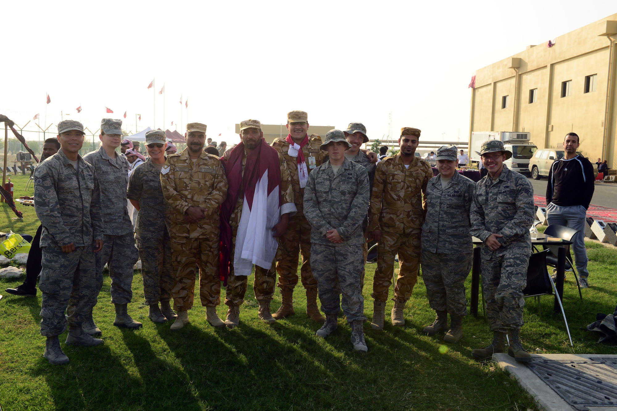 The Qatari military invited U.S. servicemembers deployed to Al Udeid Air Base, Qatar, to celebrate Qatar National Day, over breakfast, on December 18, 2014. The annual holiday is an occasion for Qataris to commemorate their national identity and history, and allows them to remember how their national unity was achieved.  This year’s Qatar National Day celebration included a parade involving all branches of the Qatari military, police, and schools. The parade featured massive fire work displays, military aircraft flyovers, and many other demonstrations of national unity.  Qatar is a key and enduring regional partner of the United States.  (photo by Master Sgt. Kerry Jackson)                          