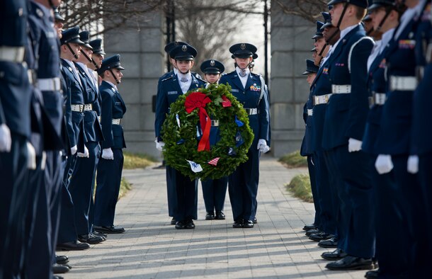 Civil Air Patrol cadets carry a wreath to be placed at a grave marker Dec. 13, 2014, during Wreaths Across America at Arlington National Cemetery in Arlington, Va. Nearly 50,000 volunteers came together to place remembrance wreaths on the headstones of about 230,000 veterans during the event. (U.S. Air Force photo/Staff Sgt. Vernon Young Jr.) 