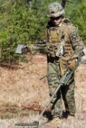 Sgt. James Downes, explosive ordnance disposal technician with Explosive Ordnance Disposal Company, 8th Engineer Support Battalion, and a Hermiston, Ore. native, walks rope back to his vehicle after he attached it to a piece of metal in the ground. EOD techs used the remote pull method to safely remove the possible threat from a distance. (U.S. Marine Corps photo by Lance Cpl. Kirstin Merrimarahajara/released)