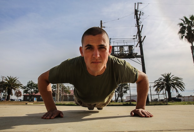 Lance Cpl. Zachary V. Maderak, Platoon 2151, Golf Company, 2nd Recruit Training Battalion, completes a push-up after finishing the Confidence Chamber at Marine Corps Base Camp Pendleton, Dec. 8. Maderak tested different career options before realizing he wanted nothing more than to be a Marine. He worked hard to fulfill his dream and is graduating both company honorman and most physically fit out of his peers.