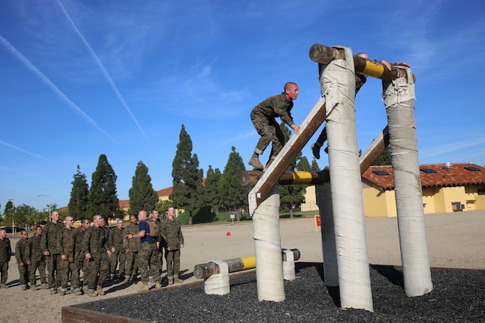 Recruits of Company L, 3rd Recruit Training Battalion manuever through the Dirty Name exercise at Marine Corps Recruit Depot San Diego, Nov. 28. The purpose of the Dirty Name is to get recruits over the fear of heights and to improve their physical fitness.
