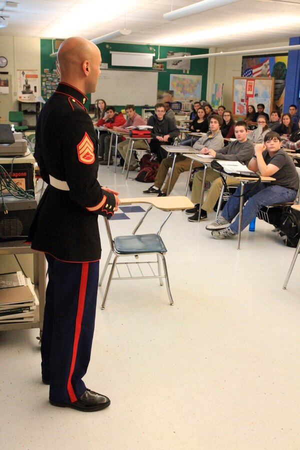 Staff Sgt. Eric Kyne talks to the students of a former teacher’s class at William H. Hall High School Dec. 18. Kyne was a student at the high school and part of its prestigious Jazz Program. Kyne is a Marine musician and recruiter with Marine Recruiting Substation Hartford. (Official Marine Corps Photo by Sgt. Richard Blumenstein)