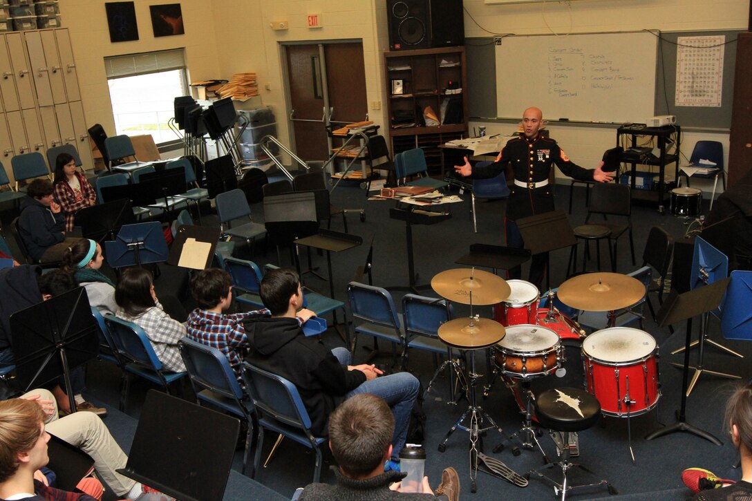 Staff Sgt. Eric Kyne talks to students about the Marine Corps Music Program at William H. Hall High School Dec. 18. Kyne was a student at the high school and part of its prestigious Jazz Program. Kyne is a Marine musician and recruiter with Marine Recruiting Substation Hartford. (Official Marine Corps Photo by Sgt. Richard Blumenstein)