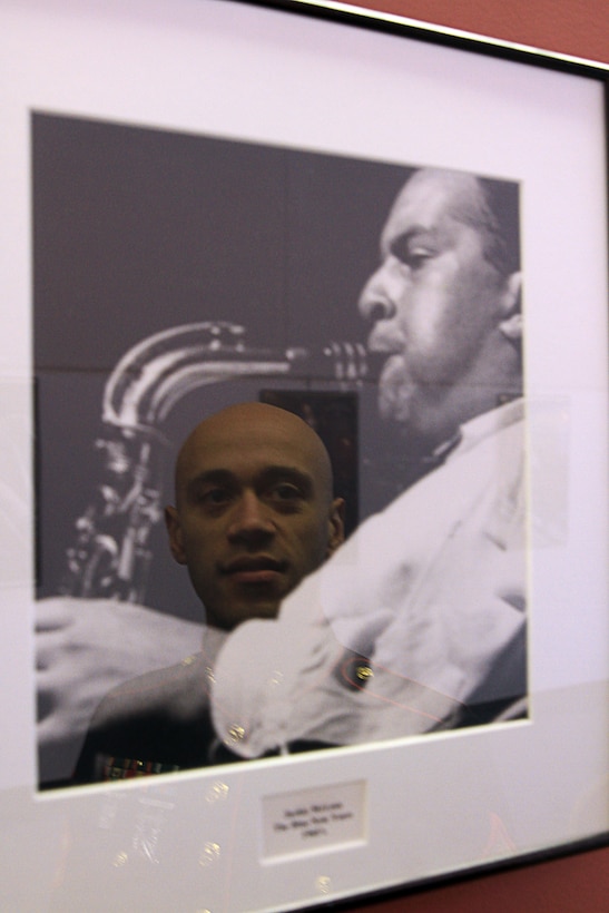 Staff Sgt. Eric Kyne looks at a photo of Jackie McLean, a famous jazz artist and founder of the Artists Collective, inside the Artists Collective in Hartford, Connecticut, Dec. 18. McLean served as one of Kyne’s first inspirations to pursue a life playing the saxophone. Kyne is a Marine musician and recruiter with Marine Recruiting Substation Hartford, (Official Marine Corps Photo by Sgt. Richard Blumenstein)