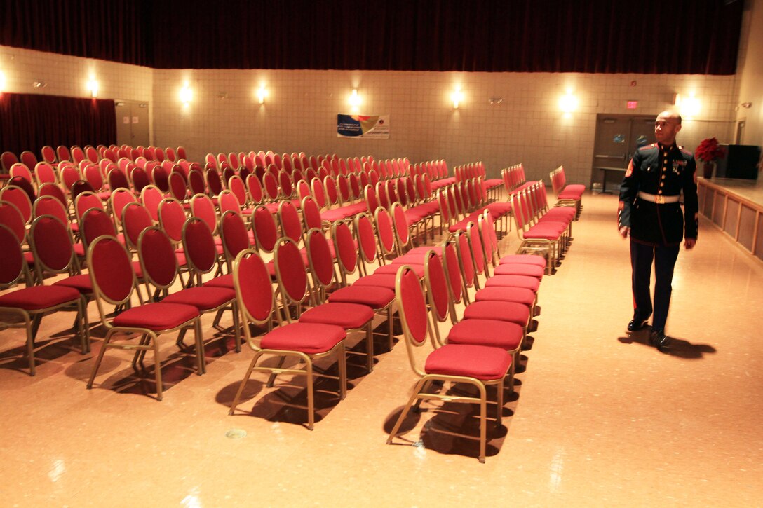 Staff Sgt. Eric Kyne walks around the auditorium inside of the Artists Collective in Hartford, Connecticut, Dec. 18. Kyne played in the auditorium throughout his childhood while he was a student there. Kyne is a Marine musician and recruiter with Marine Recruiting Substation Hartford. (Official Marine Corps Photo by Sgt. Richard Blumenstein) 