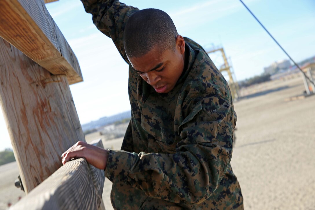 Recruits of Charlie Company, 1st Recruit Training Battalion, execute the Skyscraper exercise at Marine Corps Recruit Depot San Diego, Nov. 28. Drill instructors supervised the exercise and advised the recruits on the technique needed to complete the exercise.