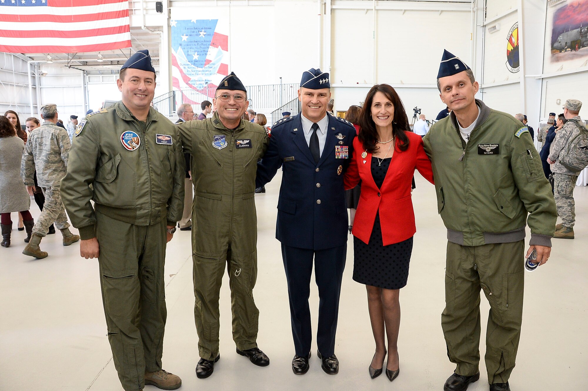 Lt. Gen. Chris Nowland, 12th Air Force (Air Forces Southern) commander, and his wife Kristan pose for a photo with the Air Forces Southern Liason Officers at Davis-Monthan AFB, Ariz., Dec. 19, 2014. 12th Air Force (Air Forces Southern) is responsible for the combat readiness of eight active-duty wings, including the 355th Fighter Wing also located at Davis-Monthan AFB, and one direct reporting unit. These subordinate commands operate more than 650 aircraft with more than 55,000 uniformed and civilian Airmen. (U.S. Air Force photo by Staff Sgt. Adam Grant/Released)