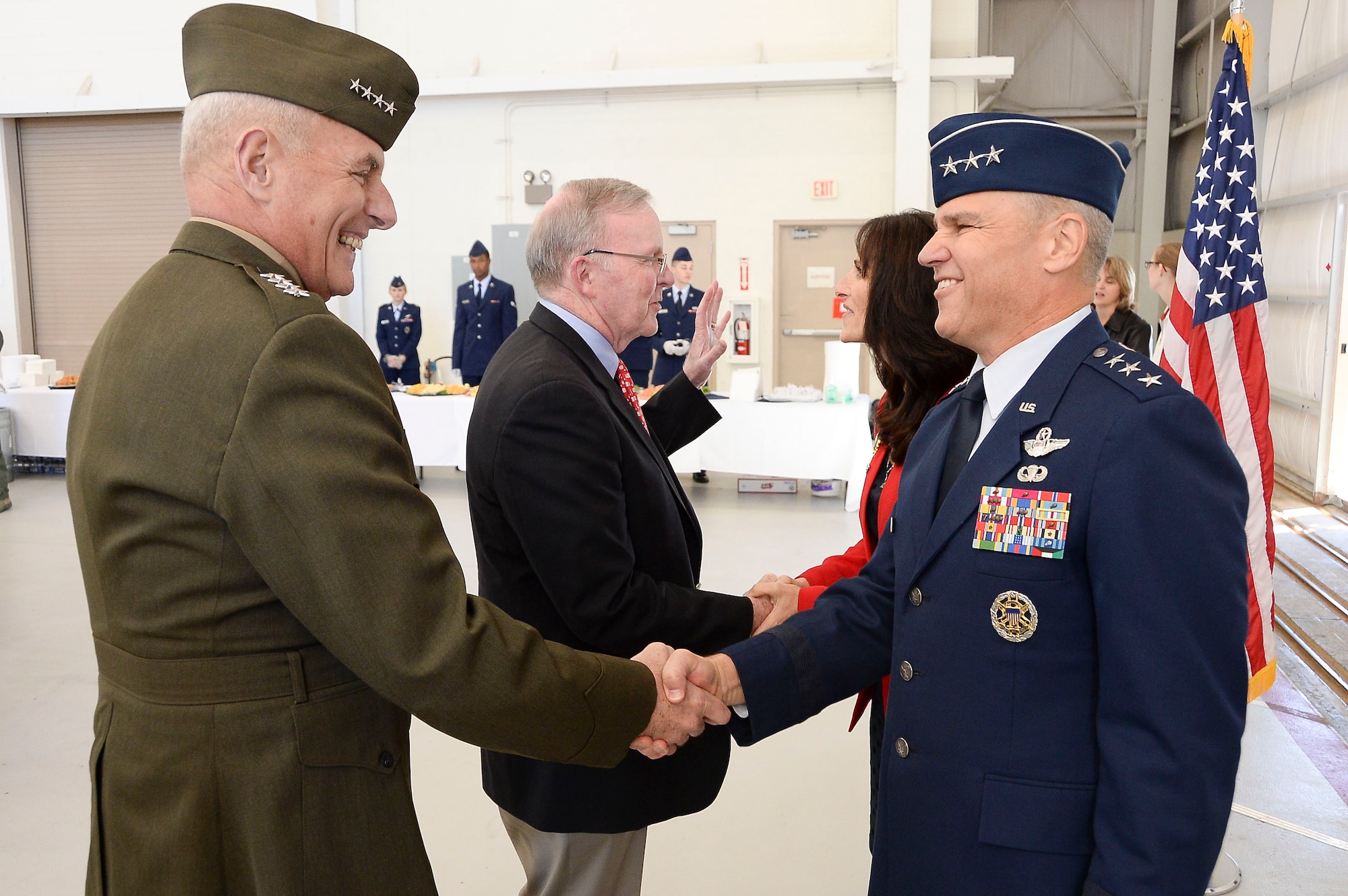 Gen. John Kelly, United States Southern Command Commander, congratulates Lt. Gen. Chris Nowland, 12th Air Force (Air Forces Southern) commander, after a change of command ceremony at Davis-Monthan AFB, Ariz., Dec. 19, 2014. Nowland comes to Tucson from his previous assignment as the Chief of Staff, Headquarters United States Southern Command, where he was responsible for successfully integrating and synchronizing the efforts of nine directorates and 16 special staff offices in support of the Combatant Commander's Theater Campaign Plan. (U.S. Air Force photo by Staff Sgt. Adam Grant/Released)