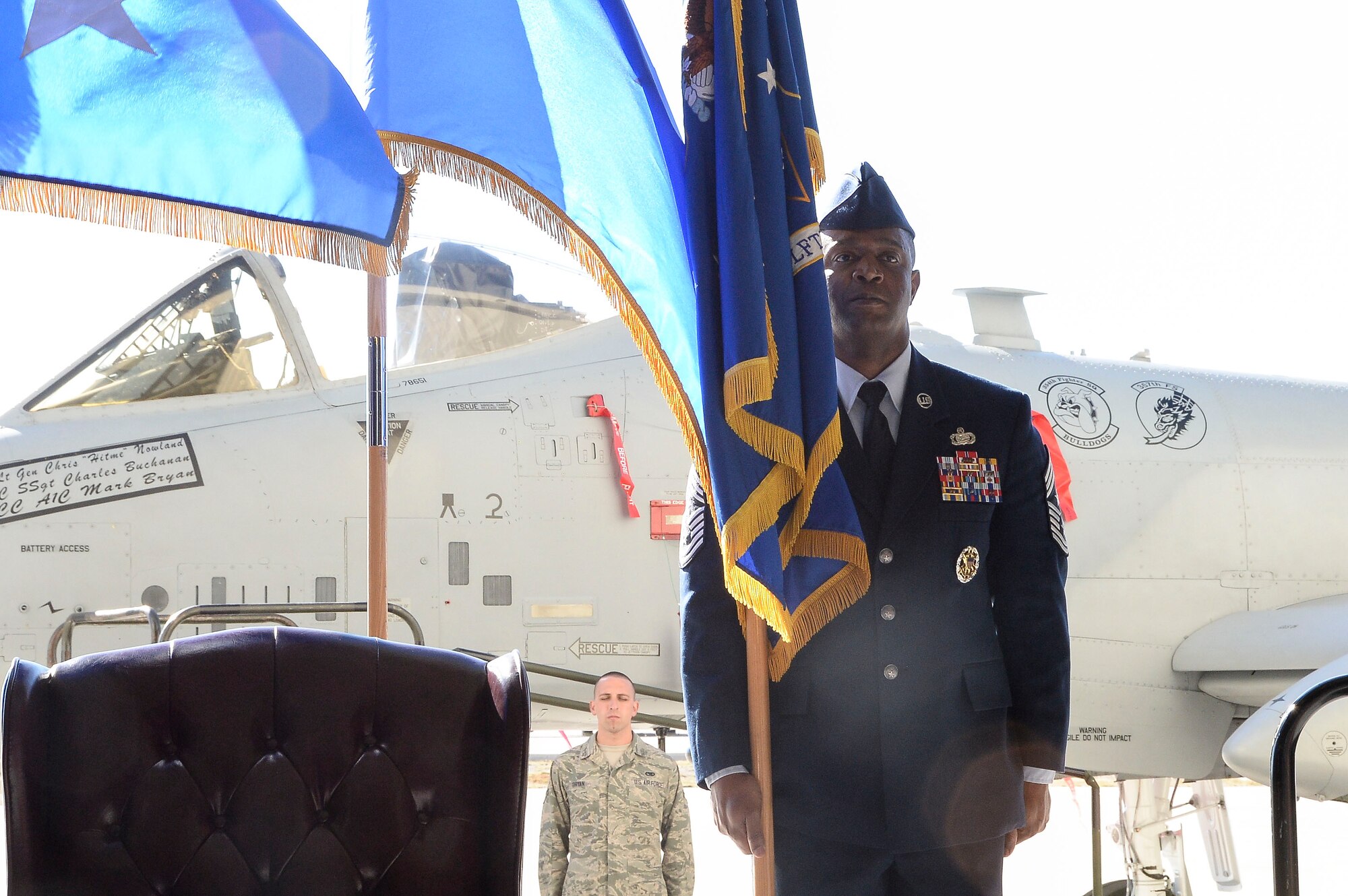 Chief Master Sgt. Calvin Williams, 12th Air Force (Air Forces Southern) Command Chief, holds the 12th AF guidon during a change of command ceremony at Davis-Monthan AFB, Ariz., Dec. 19, 2014. During the ceremony, Lt. Gen. Tod Wolters relinquished command to Lt. Gen. Chris Nowland. (U.S. Air Force photo by Staff Sgt. Adam Grant/Released)