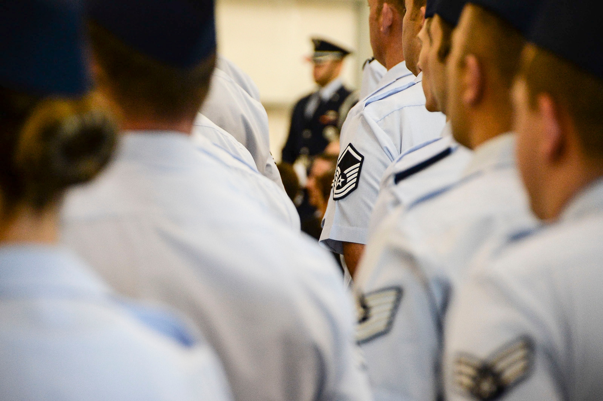 Airmen assigned to 12th Air Force (Air Forces Southern) stand at attention while awaiting the arrival of the official party during the 12th Air Force (Air Forces Southern) change of command ceremony on Davis-Monthan AFB, Ariz., Dec. 19, 2014. Lt. Gen. Tod Wolters relinquished command to Lt. Gen. Chris Nowland. (U.S. Air Force photo by Staff Sgt. Adam Grant/Released)