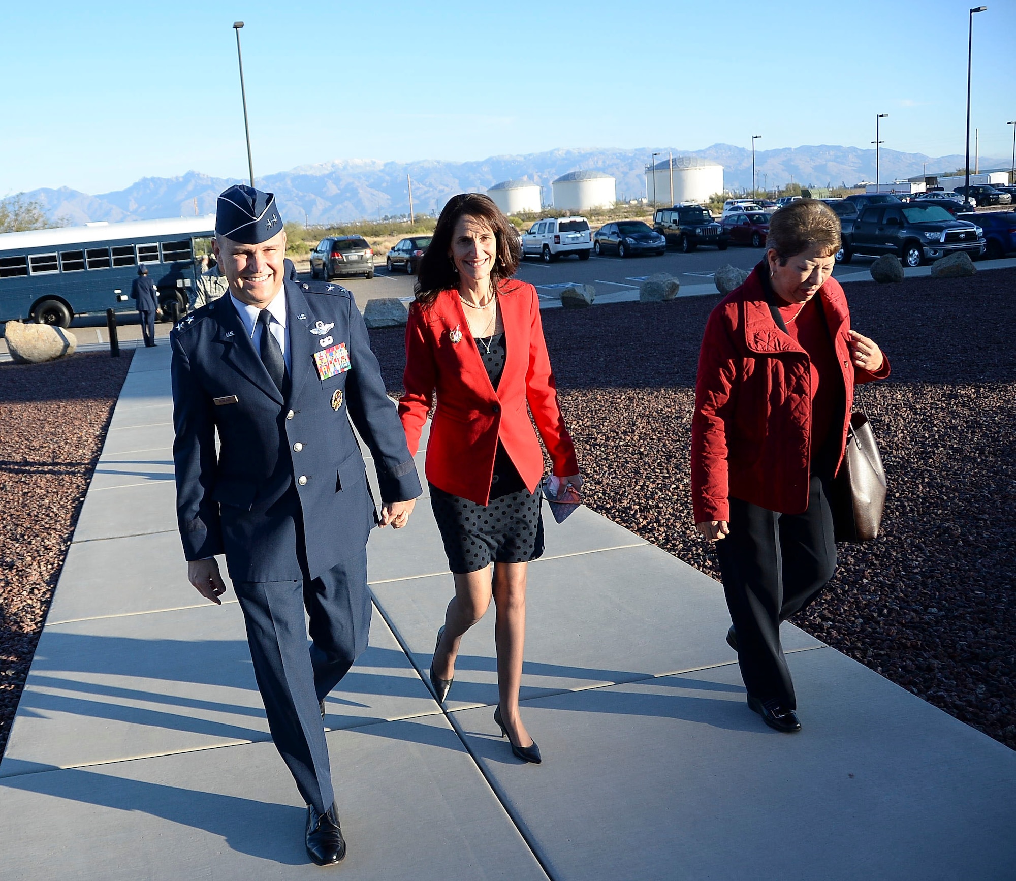 Maj. Gen. Chris Nowland, 12th Air Force (Air Forces Southern) incoming commander, and his wife Kristan walk together towards the 43rd Electronic Combat Squadron at Davis-Monthan AFB, Ariz., Dec. 19, 2014. Nowland was promoted to the rank of Lt. Gen. in a ceremony held at the 43rd ECS. (U.S. Air Force photo by Staff Sgt. Adam Grant/Released)