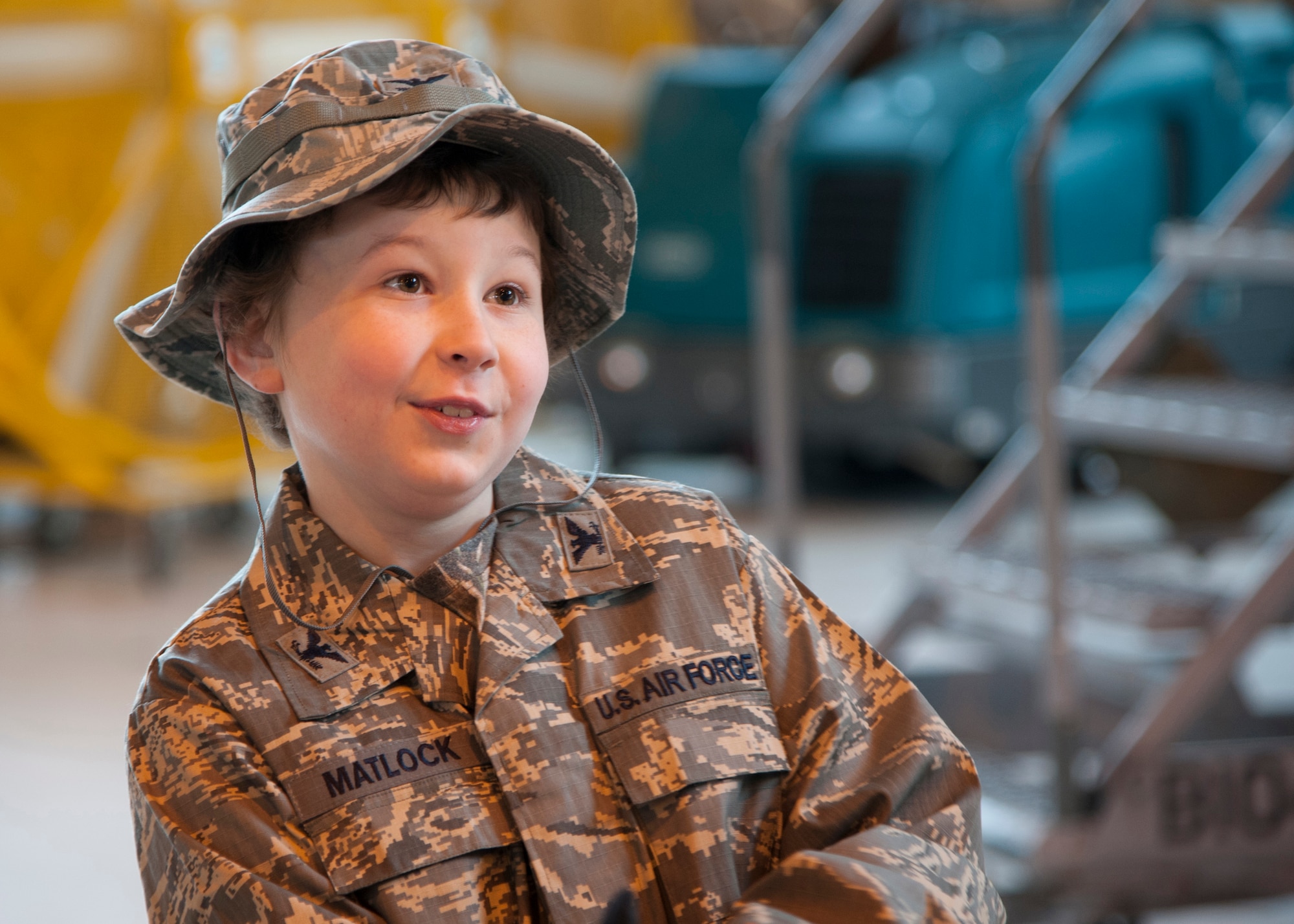 Maxwell Matlock, 10, smiles after getting down from the top of a B-52H Stratofortress on Barksdale Air Force Base, La., Dec. 18, 2014. Matlock was diagnosed with high-risk T Cell Acute Lymphoblastic Leukemia and was given a tour of a B-52H Stratofortress, presented with several items and received the title of Honorary Crew Chief to help keep his spirits up while he battles cancer. (U.S. Air Force photo/Senior Airman Joseph A. Pagán Jr.)