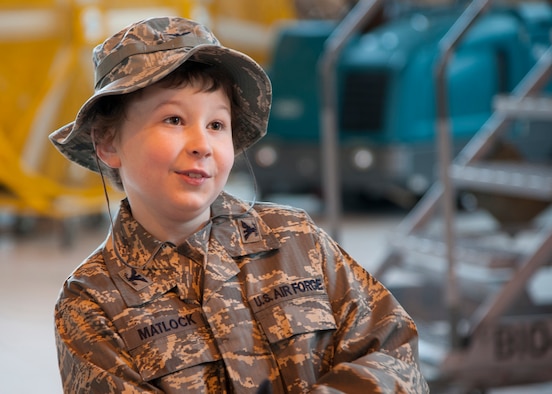 Maxwell Matlock, 10, smiles after getting down from the top of a B-52H Stratofortress on Barksdale Air Force Base, La., Dec. 18, 2014. Matlock was diagnosed with high-risk T Cell Acute Lymphoblastic Leukemia and was given a tour of a B-52H Stratofortress, presented with several items and received the title of Honorary Crew Chief to help keep his spirits up while he battles cancer. (U.S. Air Force photo/Senior Airman Joseph A. Pagán Jr.)