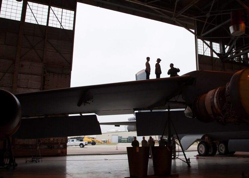 Senior Airman Marco Armenta, 2nd Maintenance Squadron crew chief, right, gives a tour of a B-52H Stratofortress to Monty and Maxwell Matlock on Barksdale Air Force Base, La., Dec. 18, 2014. Max was diagnosed with high-risk T Cell Acute Lymphoblastic Leukemia and had his dream come true when a family friend, Tech. Sgt. Mark Haines, 2nd Maintenance Group maintenance operation squadron NCO in-charge, gave him the opportunity to become an Honorary Crew Chief. (U.S. Air Force photo/Senior Airman Joseph A. Pagán Jr.)