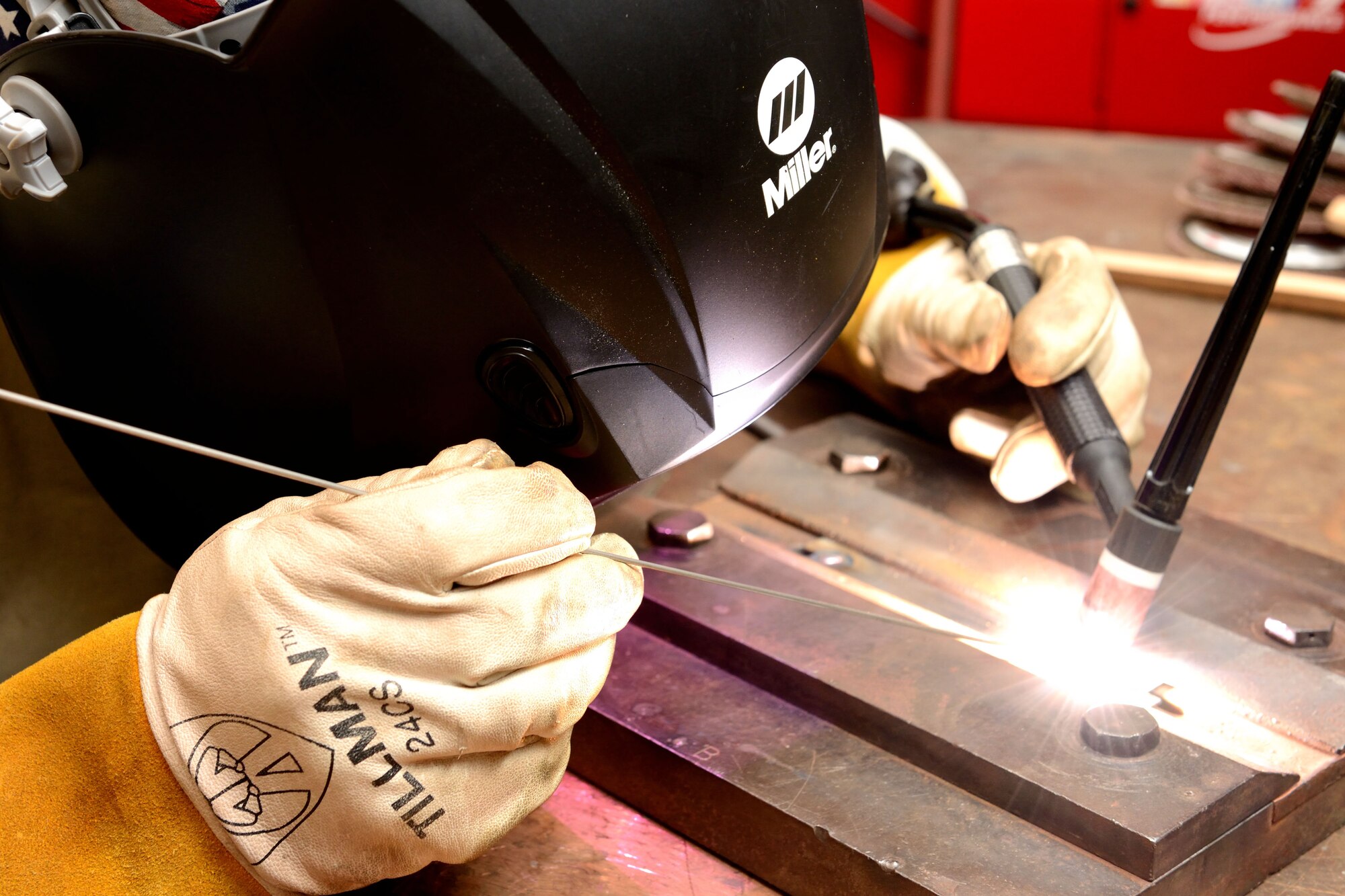 Airman 1st Class Thomas Showers, 403rd Fabrication Flight metals technologist, practices tungsten inert gas welding on a piece of stainless steel for his welding certification December 6, 2014. Fabrication flight members build and repair various items and equipment for 403rd Wing shops at Keesler Air Force Base, Mississippi. (U.S. Air Force photo/Tech. Sgt. Ryan Labadens)