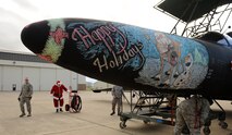 Decorative nose art was placed on a U-2 Dragon Lady during the Children's Holiday Party at Beale Air Force Base, Calif., Dec. 13, 2014. Santa arrived at the event in a U-2.(U.S. Air Force photo by Staff Sgt. Robert M. Trujillo/Released)